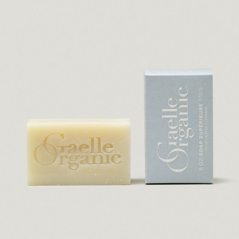 A bar of Soap Superieure moisturizing cleanser with Gaelle Organic logo, next to its outer box on a white background