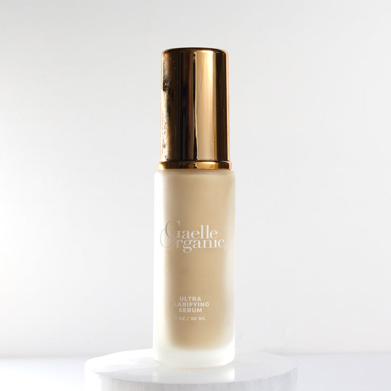 Backlit image of Ultra Clarifying Serum, the best organic serum for soothing redness and breakouts
