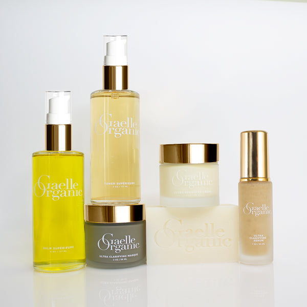 The Clarifying Collection, organic anti-aging products for reactive skin on a plain background