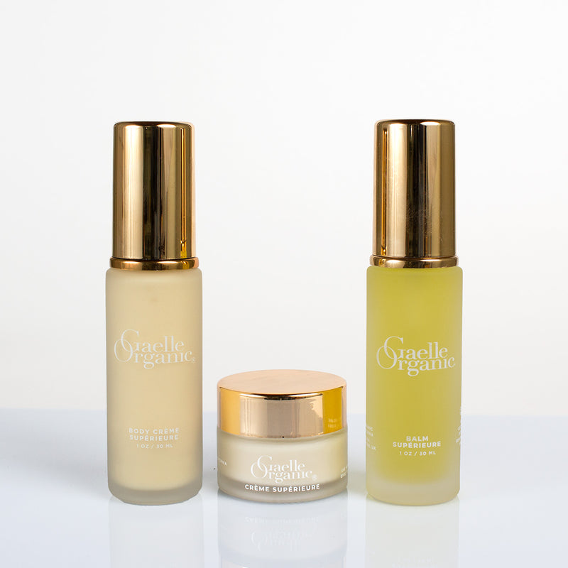 Affordable natural radiance boosters in travel sizes on a plain background