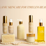 Group of Gaelle Organic skincare products for mature skin, with pearls, on an ivory background.