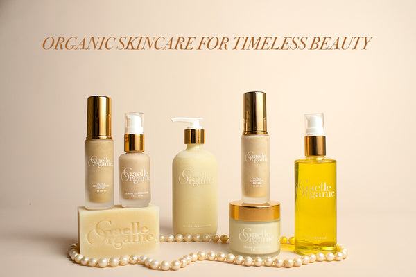 Group of Gaelle Organic skincare products for mature skin, with pearls, on an ivory background.
