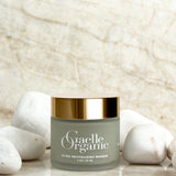 Ultra Revitalizing Masque, the best mask for mature skin, on a marble counter with white stones