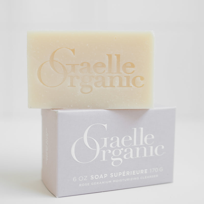 Gaelle Organic Soap Superieure, the best cleanser for mature skin, atop its outer box, on a white background