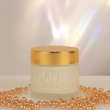Ultra Sensitive Creme, the best anti-aging moisturizer for dry sensitive skin, with shiny golden beads and a light prism background.