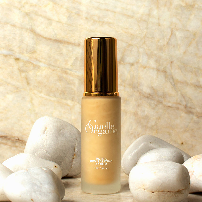Ultra Revitalizing Serum, the best serum for fine lines and wrinkles, on marble with white stones